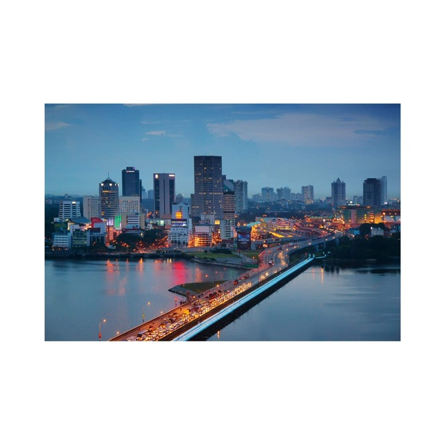 The Johor Bahru at sunset seen across the Causeway from Woodlands, Singapore .